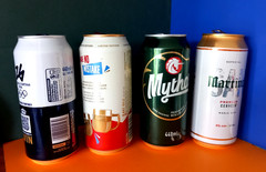 x 4 EMPTY BEER CANS BUDWAR, MYTHOS, MARTINEZ, CORONA EXTRA MILANO CORTINA 2026